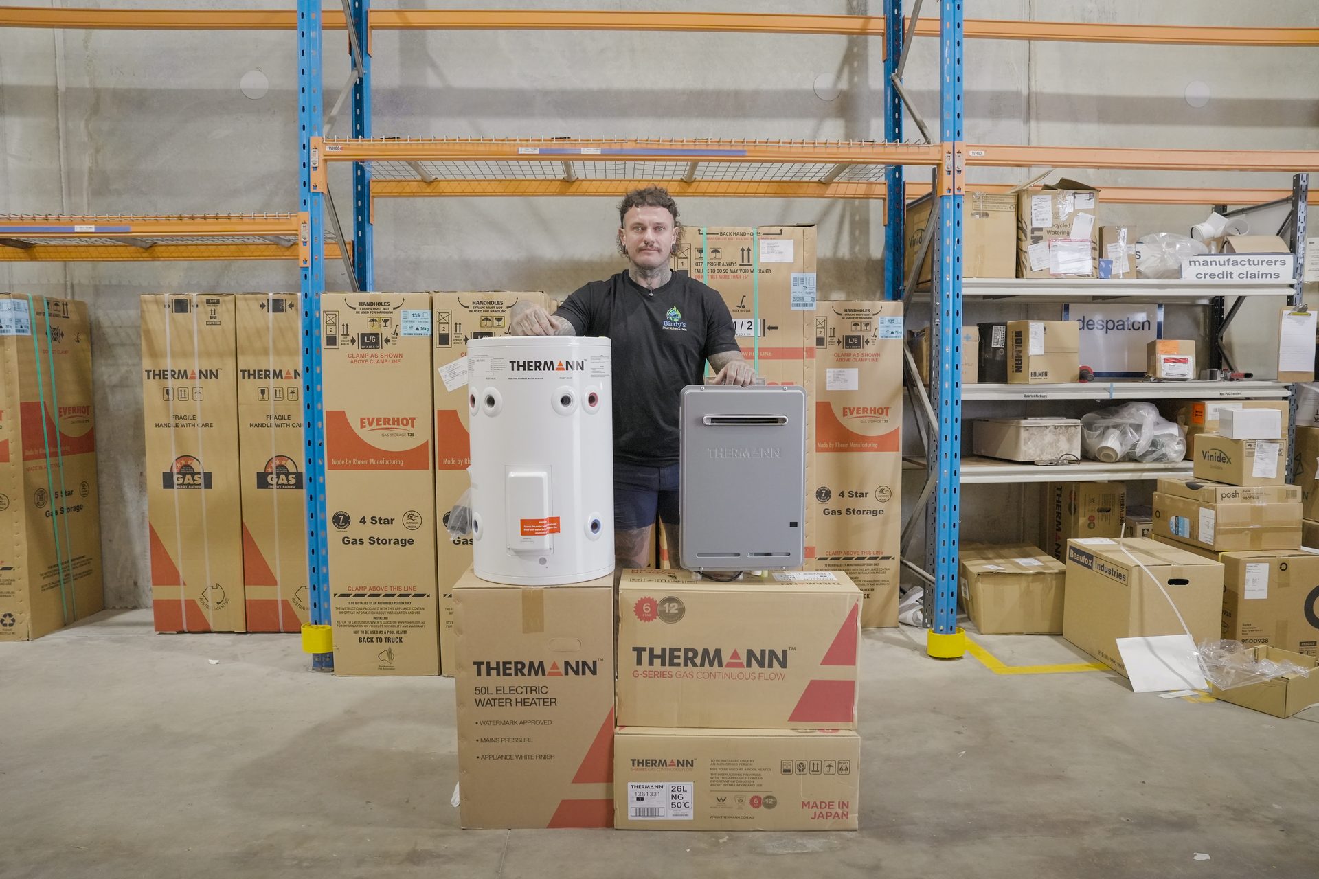 Ruben Bird with hot water systems in the warehouse